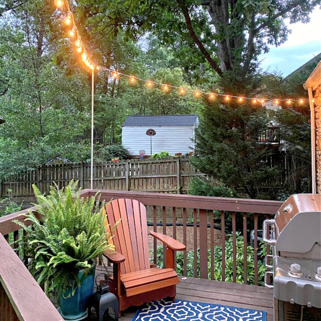 Pole to hang string lights on deck store